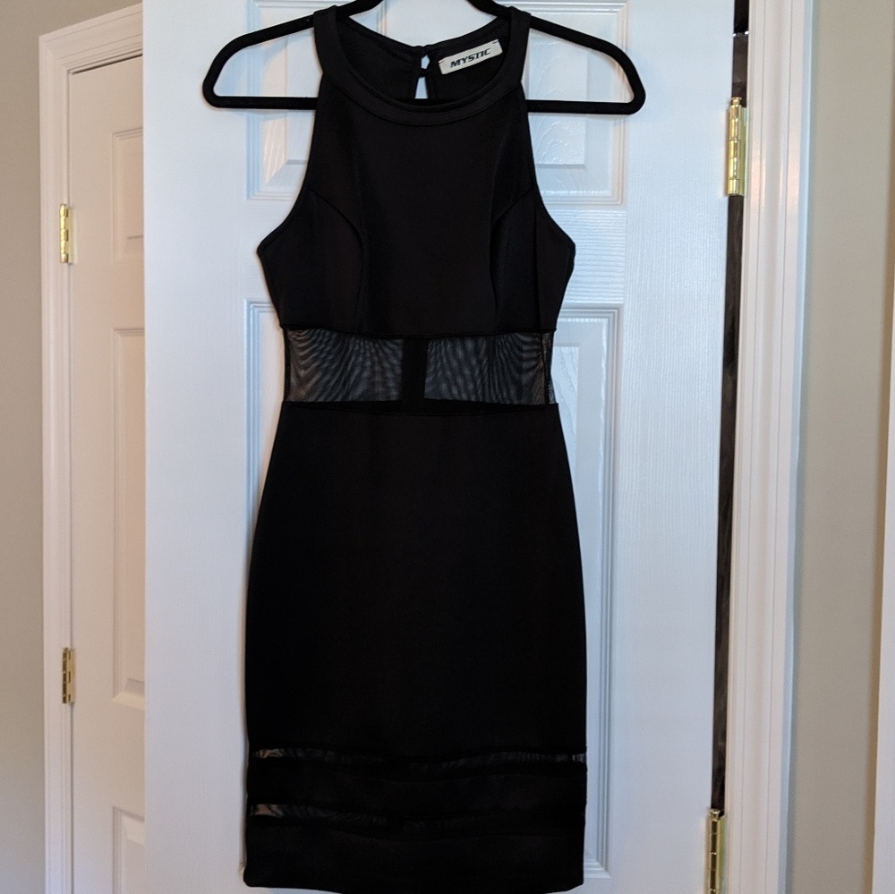 Black dress, falls below knee